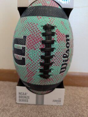 New in box NCAA bronze series junior Wilson football teal pink blue